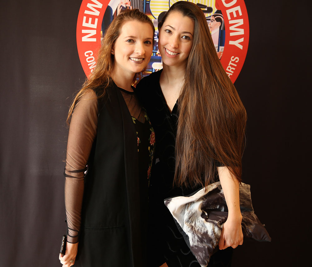 two female nyfa students at the 2016 fall film commencement ceremony
