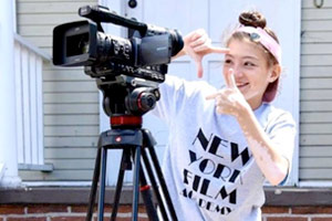 Young girl with Camera at Young Storytellers