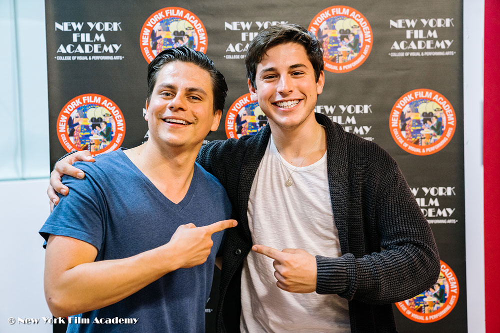 Two friends posing for the camera at the NYFA LA Alumni Industry Showcase.