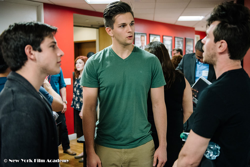Three students talking at the NYFA LA Alumni Industry Showcase.