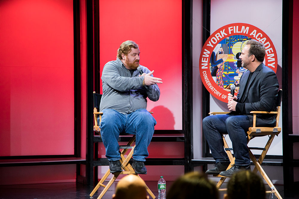 NYFA Conservatory of Visual & Performing Arts acting screening Q&A with two men in directors chairs on stage answering the audience's questions. 