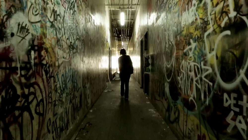 NYFA Final Scene Stills moves still from Monster of actor walking down graffiti hallway.