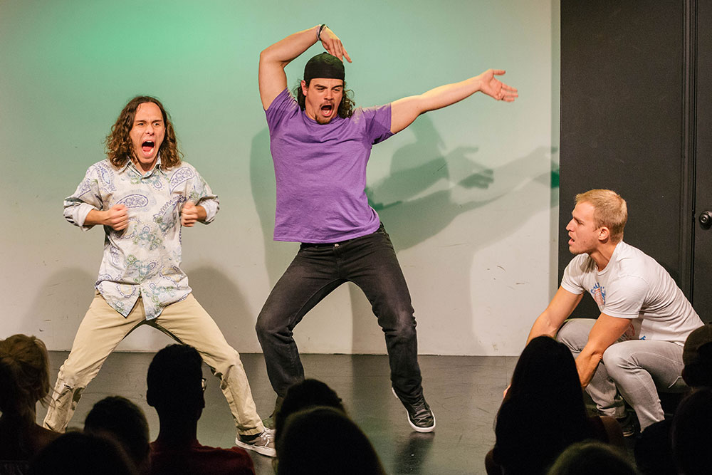 NYFA LA play actors performing improv on stage in front of a crowd