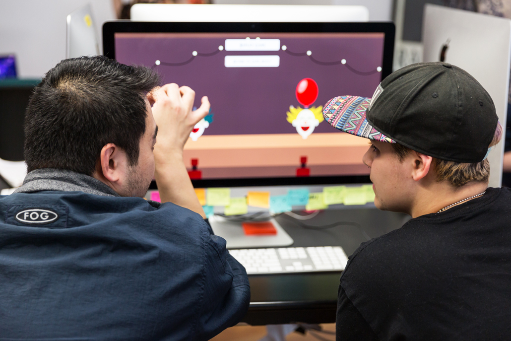Two men playing a computer game