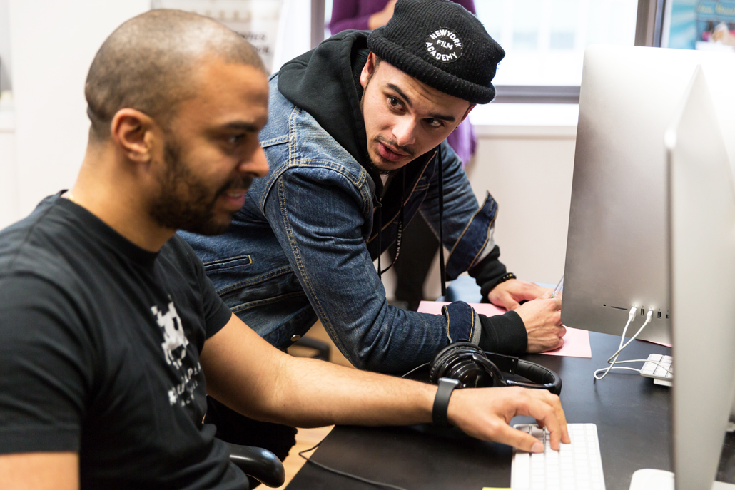 Students talking while on computers