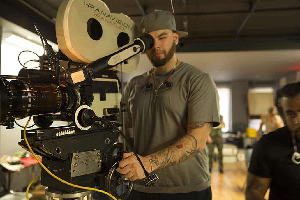 Crew member using Panavision camera