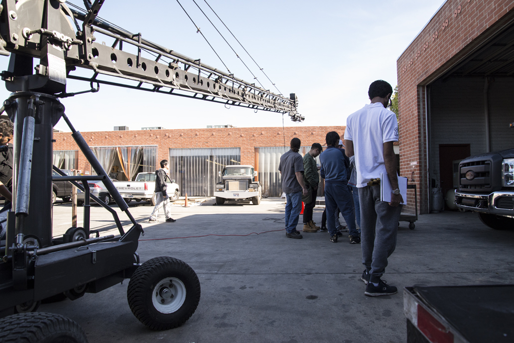 People gathered outside a garage