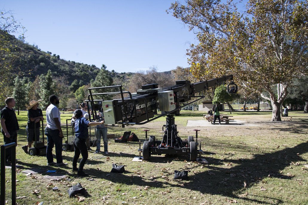 Camera crew filming in a park