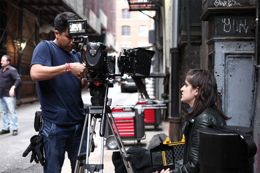 Crew members adjusting camera