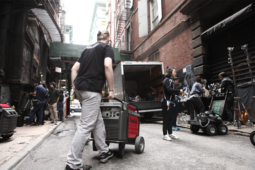 Crew members unloading equipment from truck