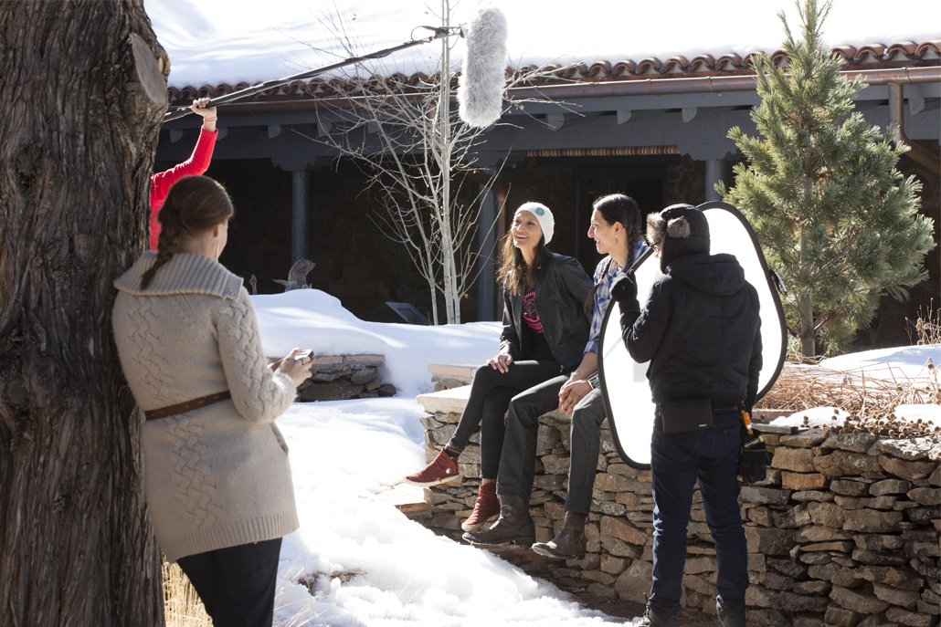 Two women being interviewed by film crew outside 