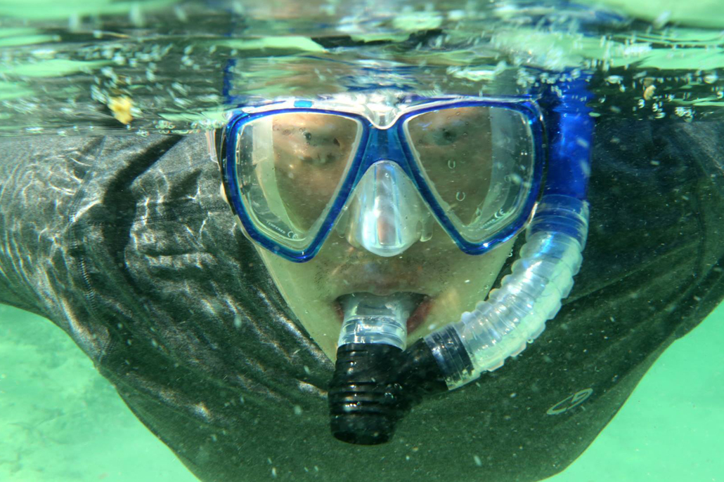 Person underwater snorkeling
