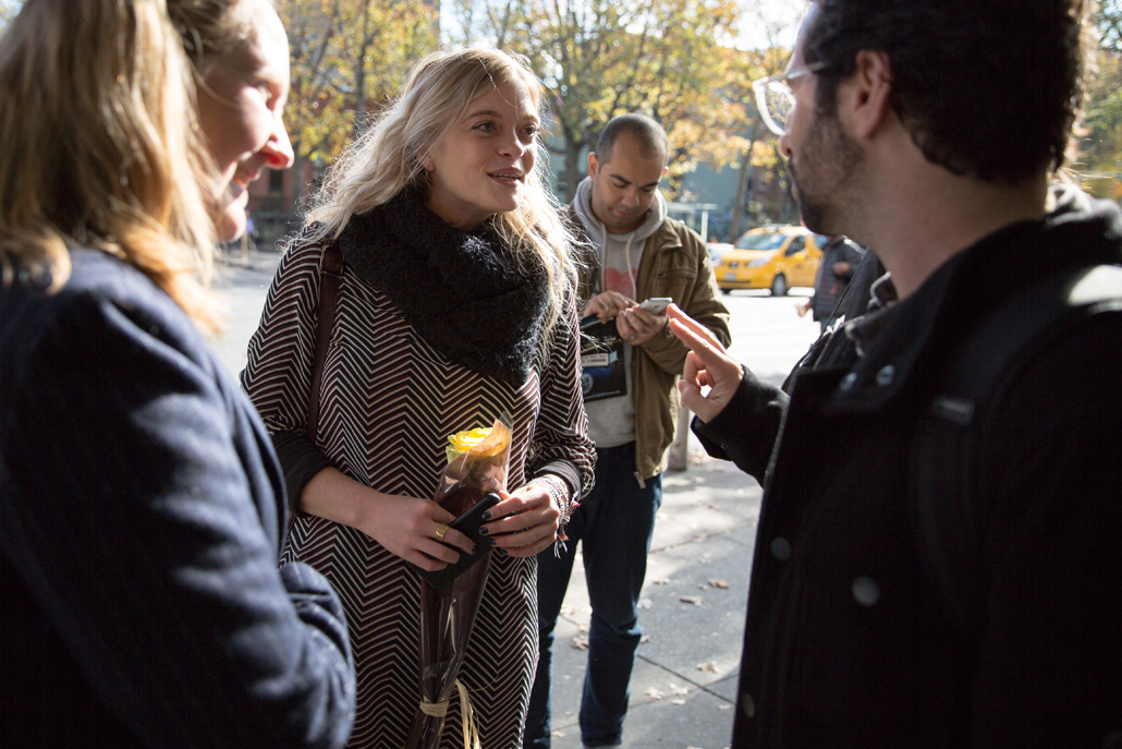 People talking to each other outside on street