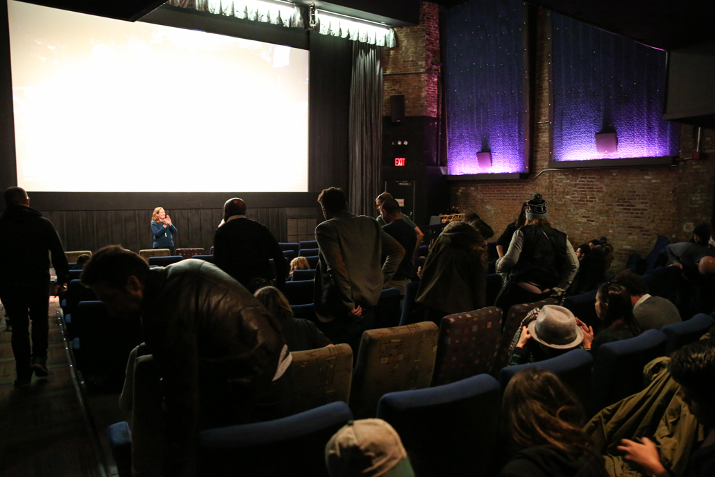 Small theater with people sitting in seats