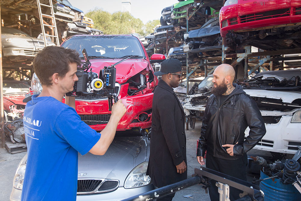 two men on set in junkyard