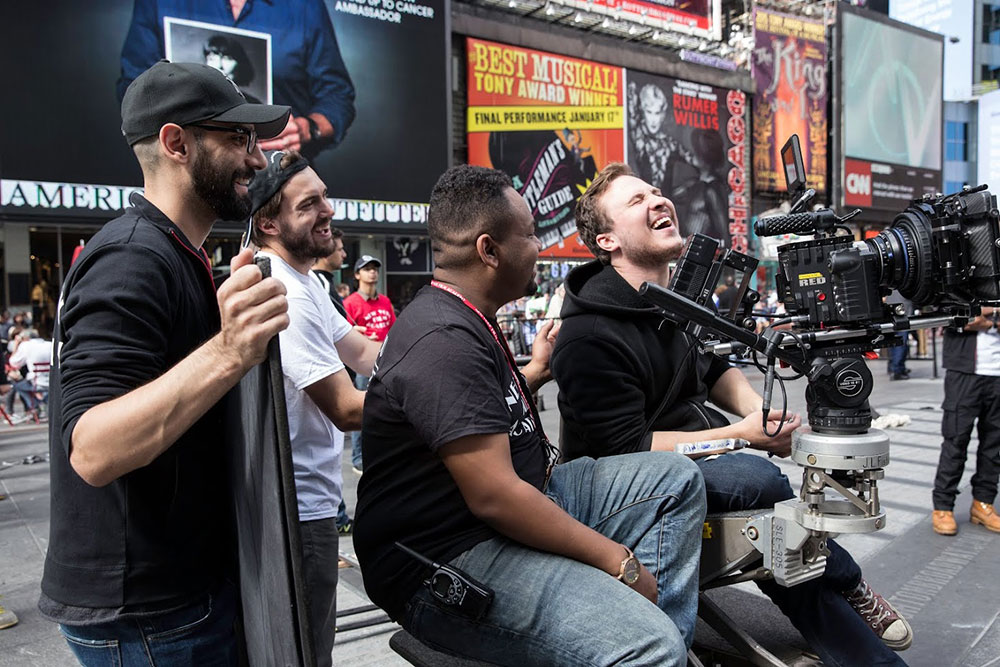 students laughing on set