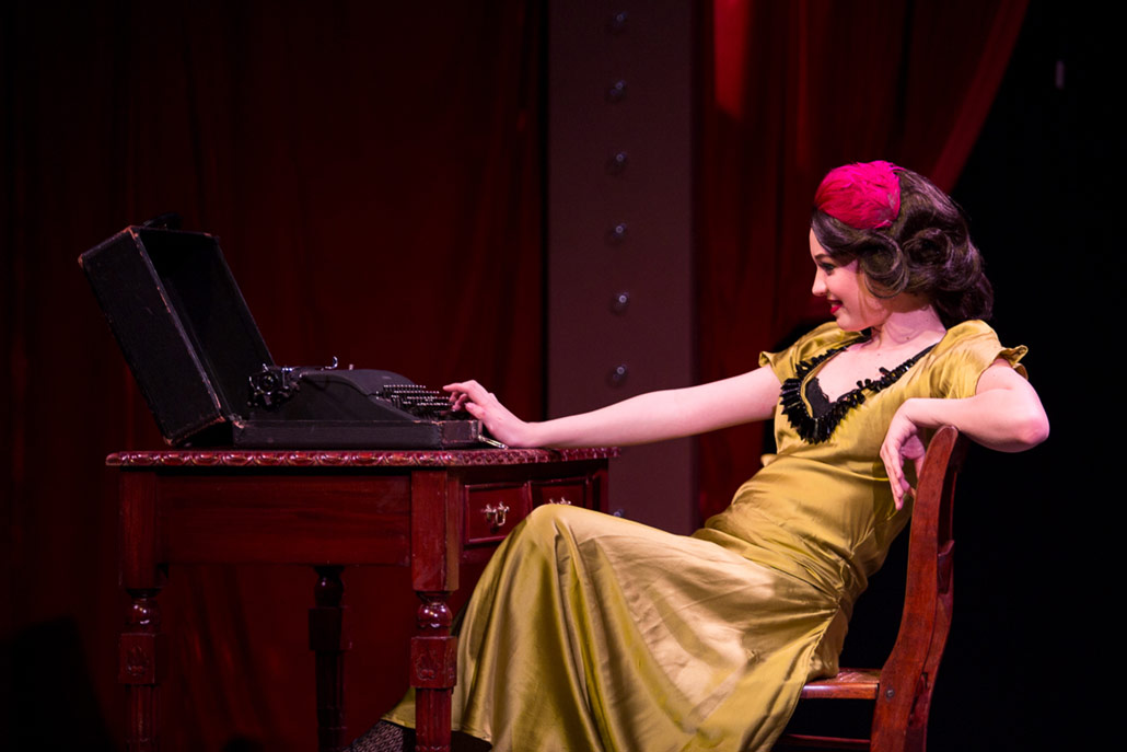 girl typing on typewriter