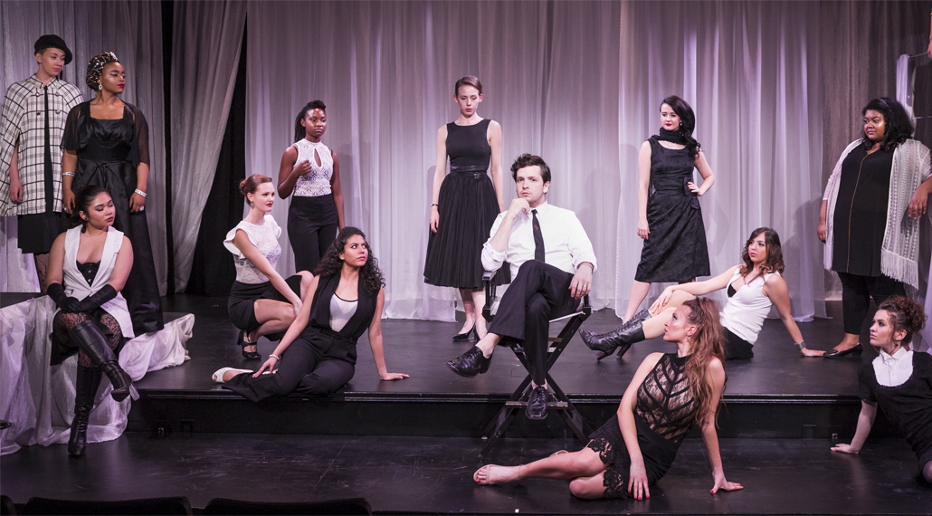 Nine Cast Pose On Stage