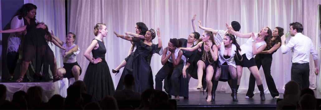 Nine Female Cast Pose on Stage