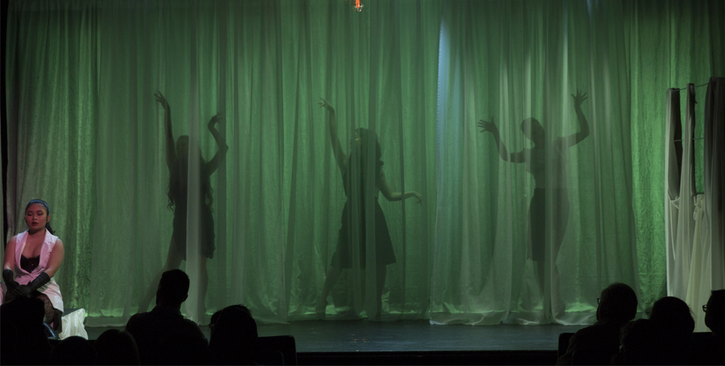 Nine Three Female Performers Behind Curtain