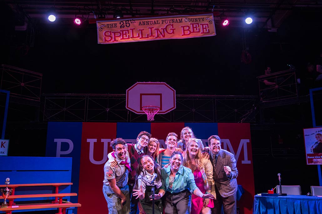 NYFA student ensemble smiles and poses togehter in Spelling Bee.
