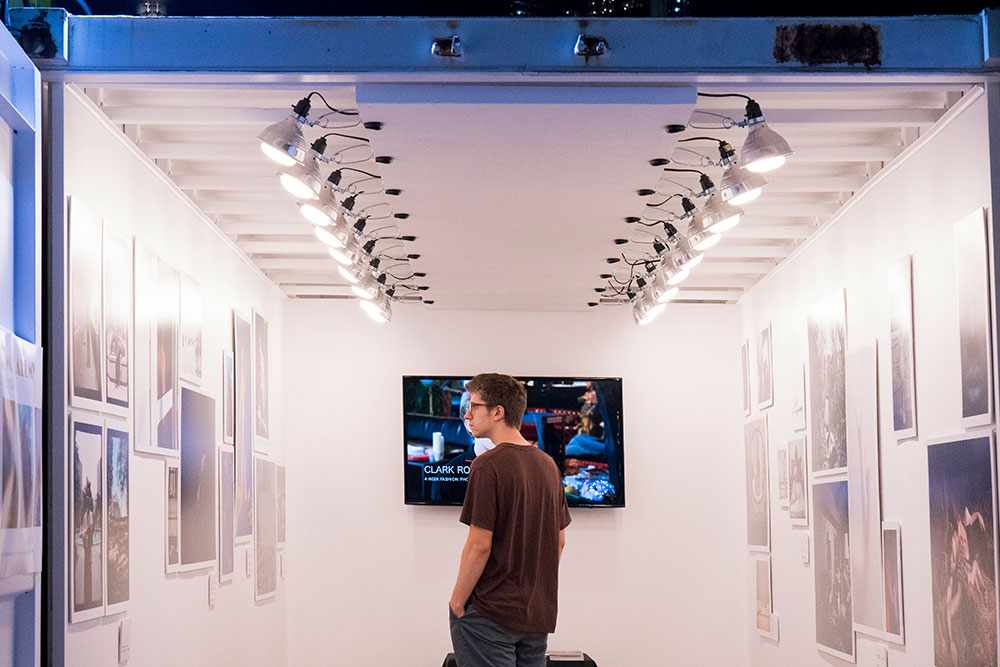 Man standing in art exhibit room