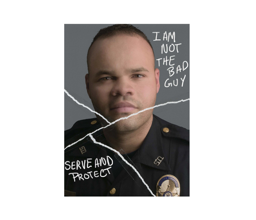 Police officer posing with 'I am not the bad guy' and 'Serve and Protect' written on top