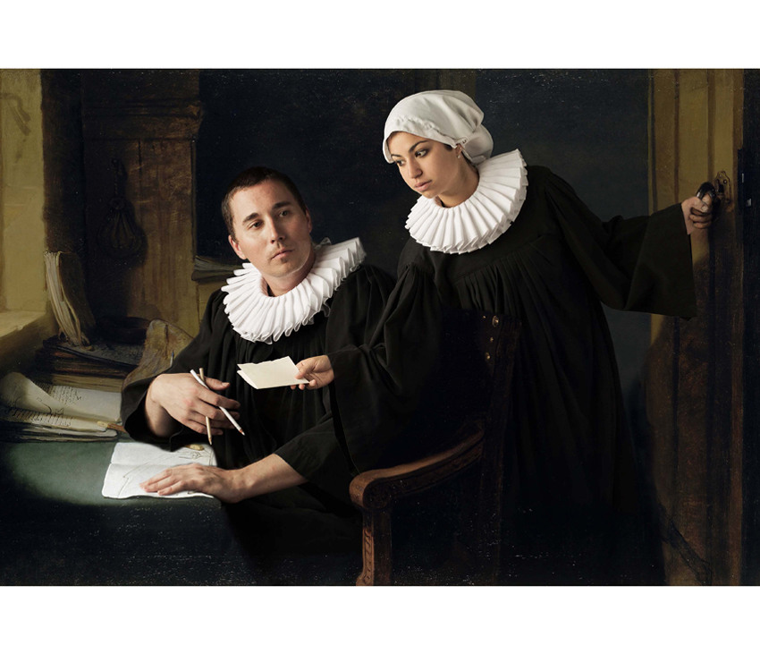 Man and woman in black and white robes exchanging papers
