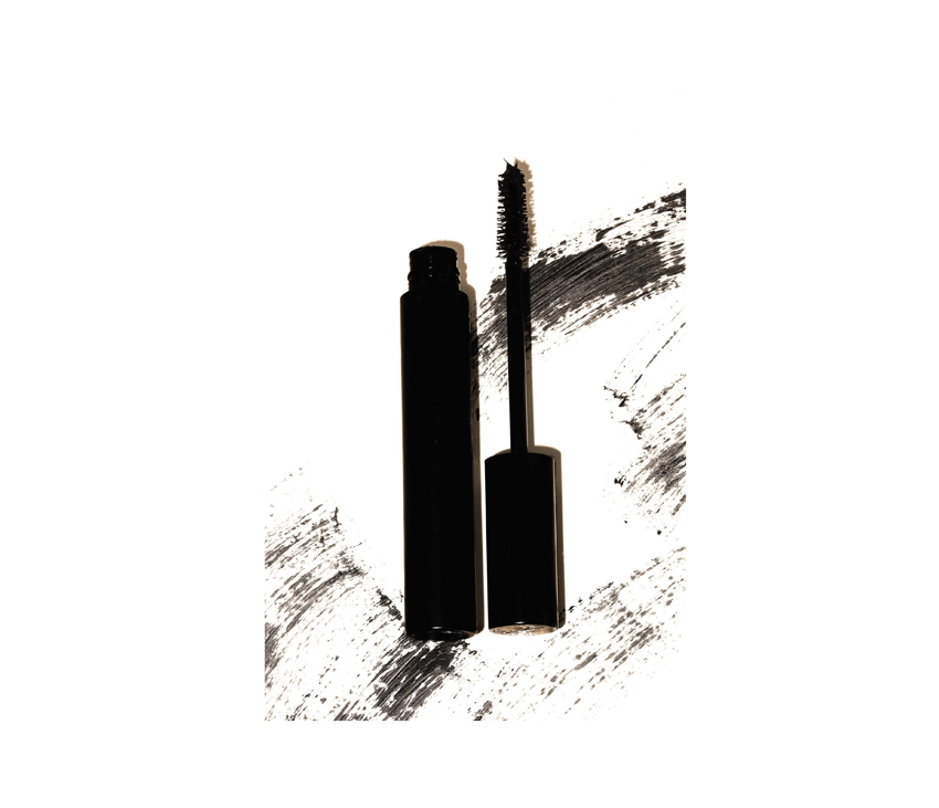 Graphic of black mascara with black and white background