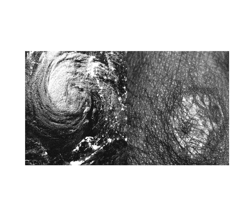 Aerial photo of hurricane next to rocky landscape