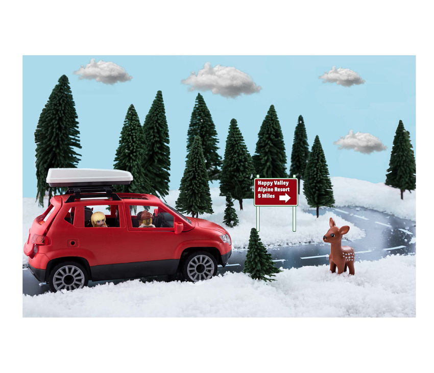 Animated red car driving up snowy hill with Lego characters inside