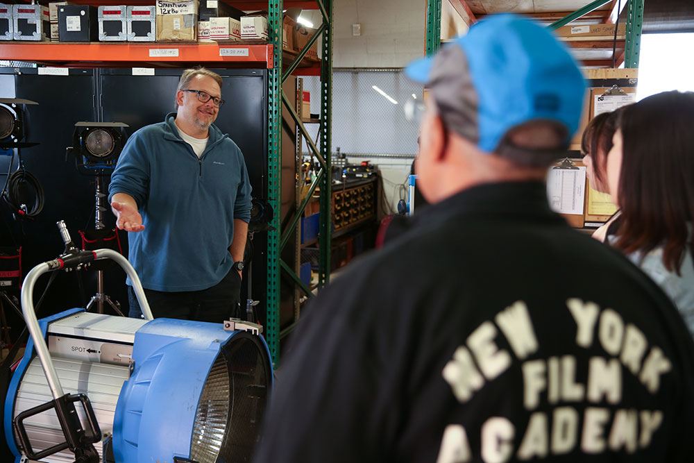 Tour guide from Grounded Tour explaining film equipment to NYFA class.