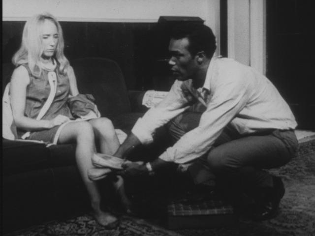 Ben_giving_Barbra_slippers_in_Night_of_the_Living_Dead_bw