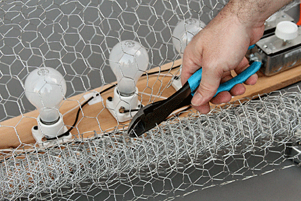 Cutting chicken wire to create a covered wagon for lighting