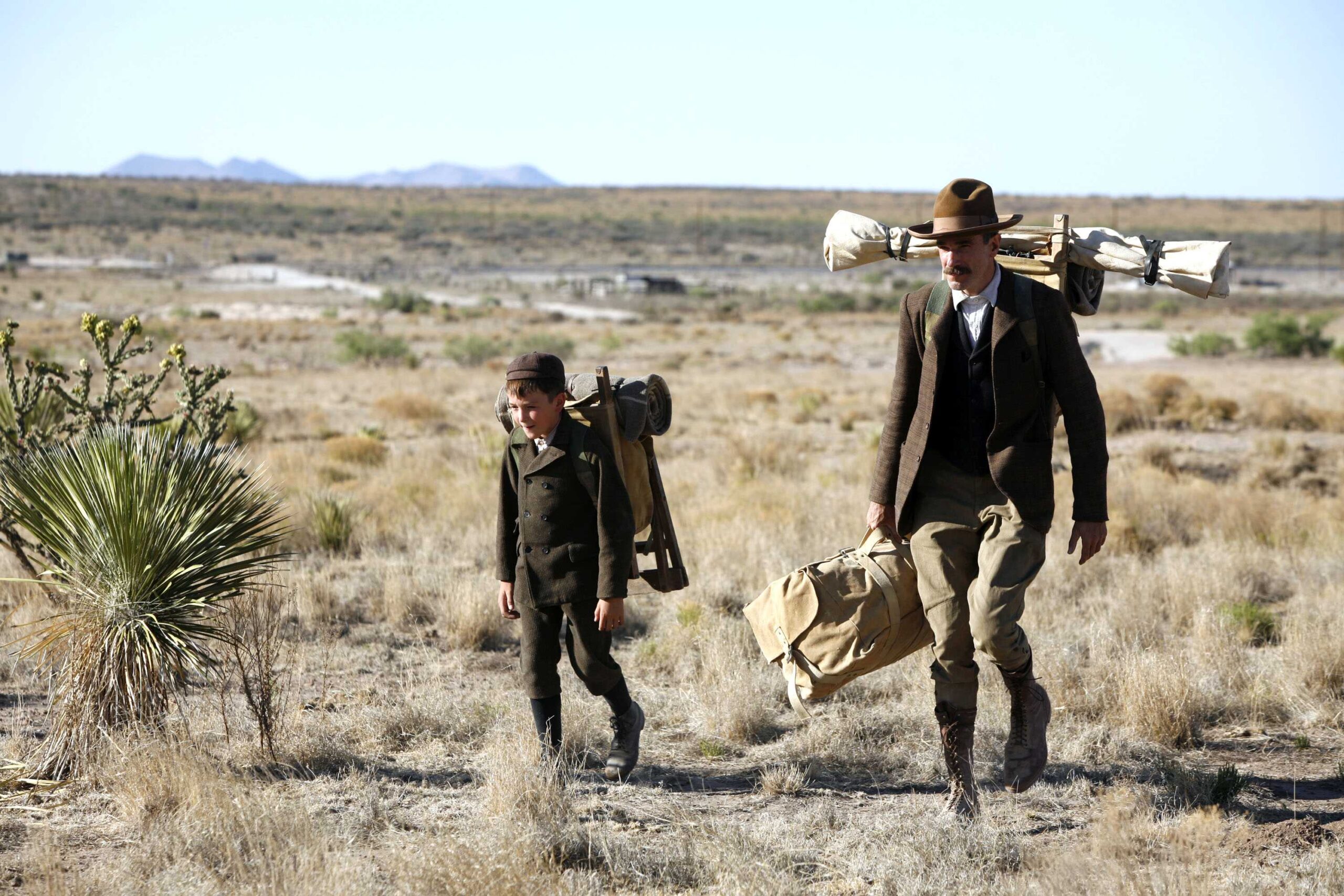 Daniel Day Lewis and son walk in There Will Be Blood