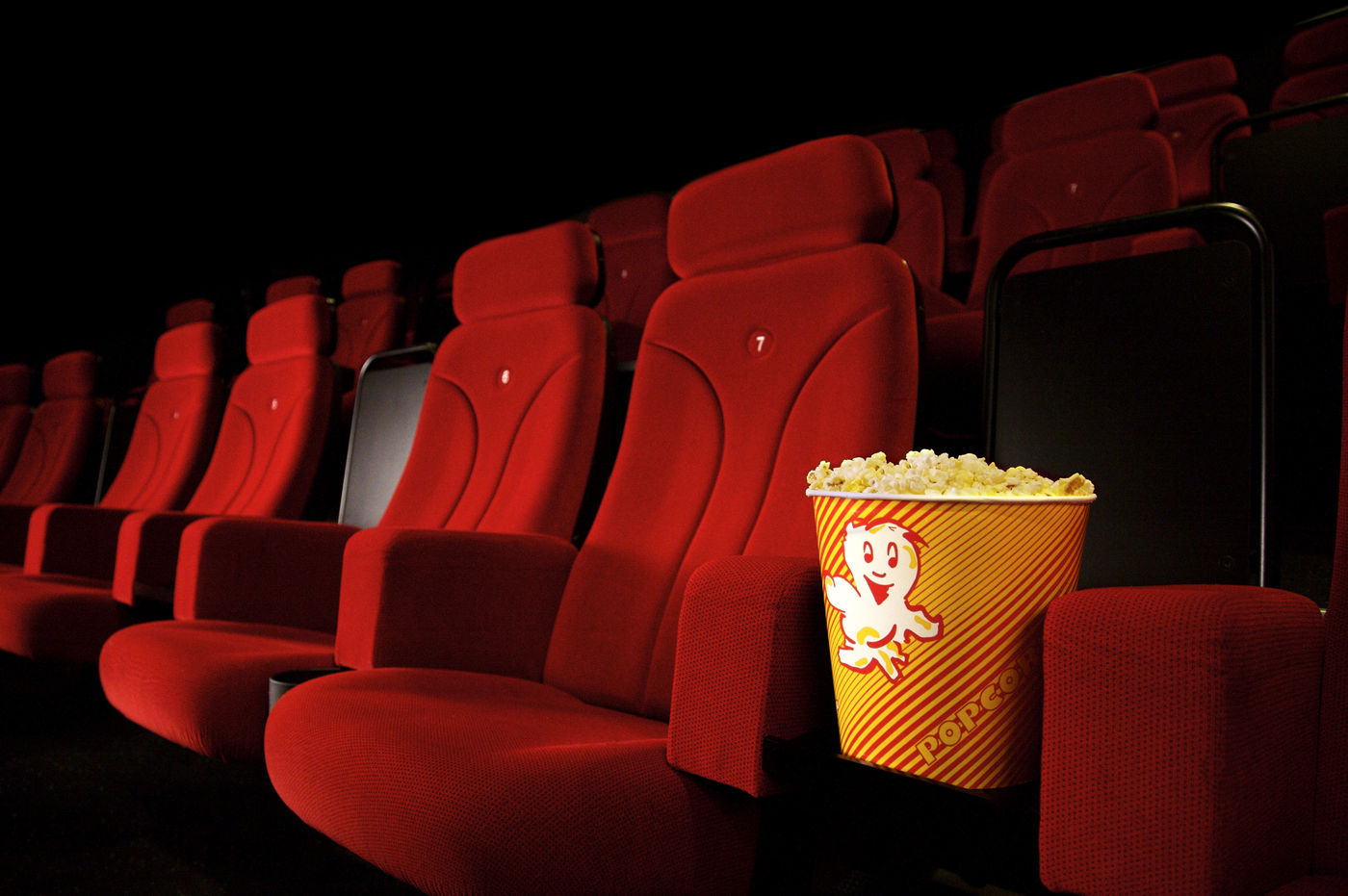 Movie theatre seats with popcorn