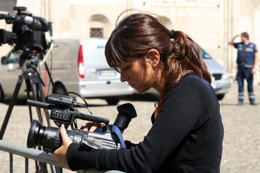 Woman setting up a camera