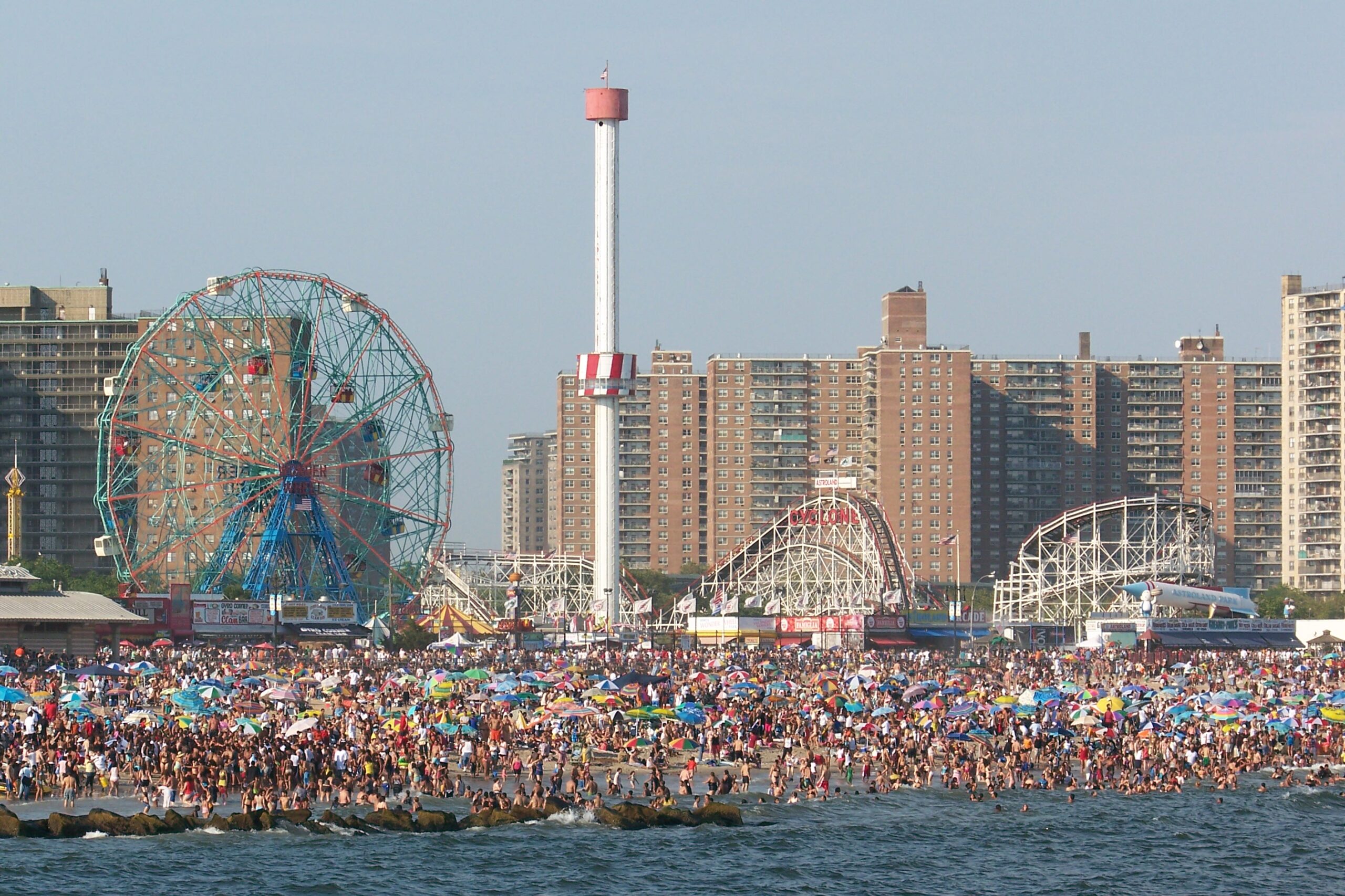 People loung on the beach at Coney Island 