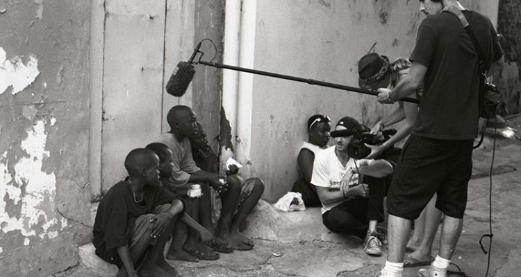 Documentary filmmakers interviewing children in the street