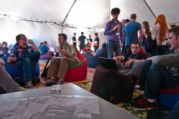 Indiecade exhibitors lounge in a booth