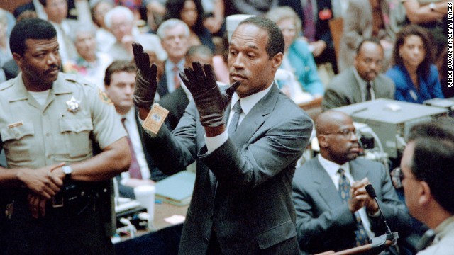 OJ Simpson trying on gloves