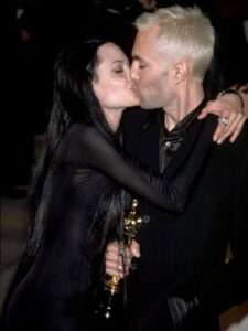 Angelina Jolie kisses her brother after the Oscars