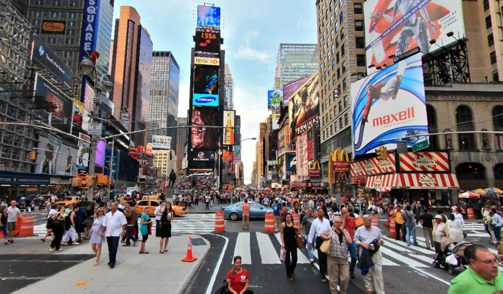 Tourists explore Times Square in NYC