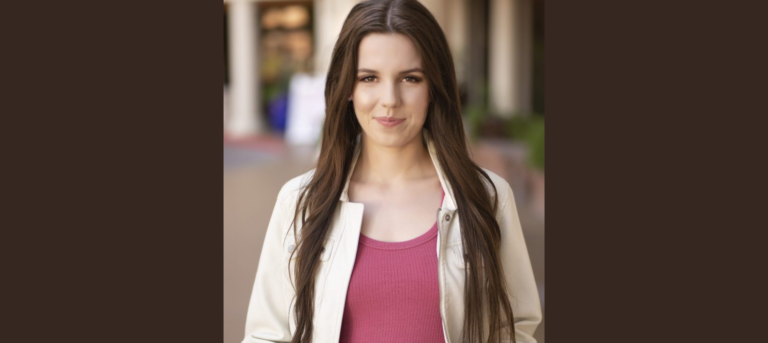 Image of woman in pink top and beige jacket